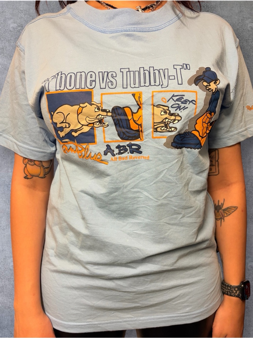 'T-Bone vs Tubby-T' ray blue Y2K tee